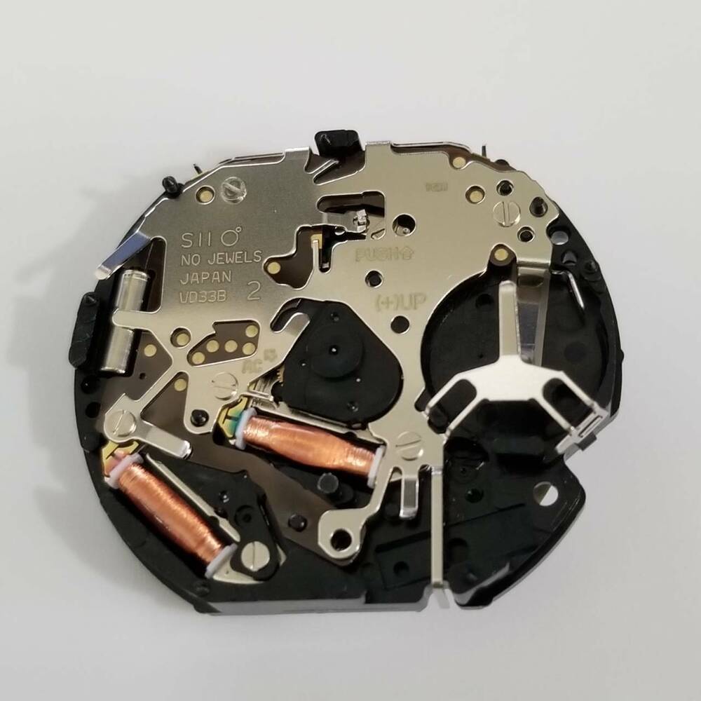 Hattori Epson VD33A quartz watch movement, Japan-made repair part for accurate timekeeping.