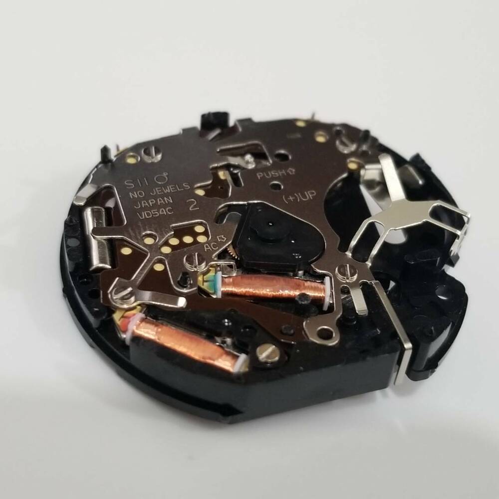 Hattori Epson TMI VD54 quartz watch movement for accurate watch repair and replacement parts.
