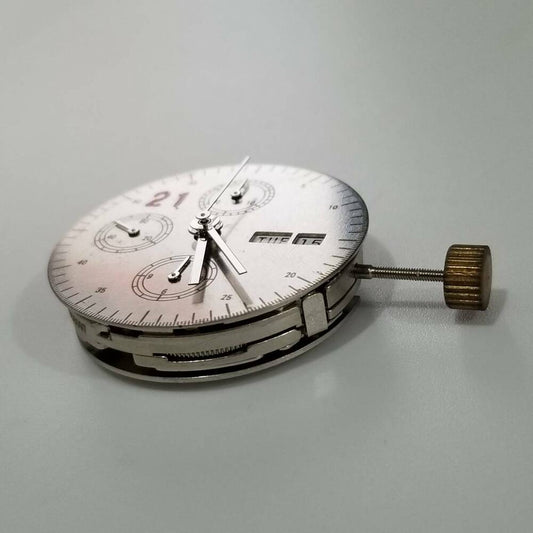 DANDONG 7750 mechanical automatic watch movement with white day and date display for repairs.