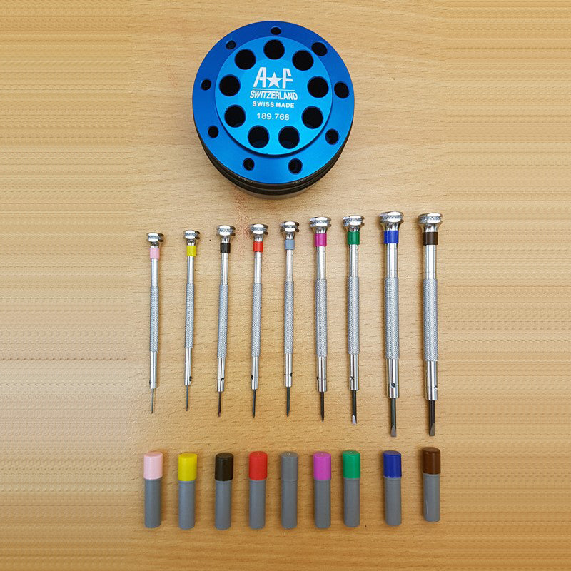 A*F 189.768 watch repair precision screwdriver set with 9 tools, spare blades, and durable base for accessories.