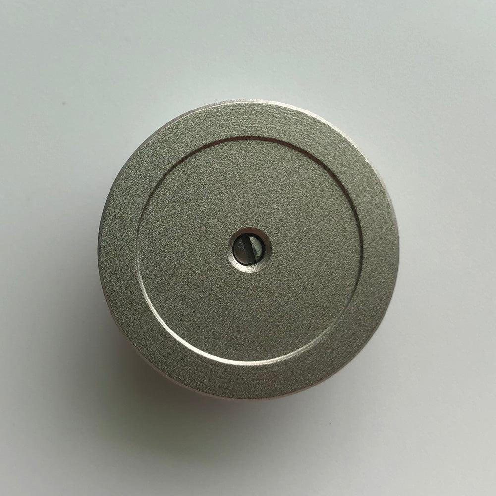 Bergeon 1997 DI 834 watch movement holder with center screw for precise 8-3/4 ligne watch repairs.
