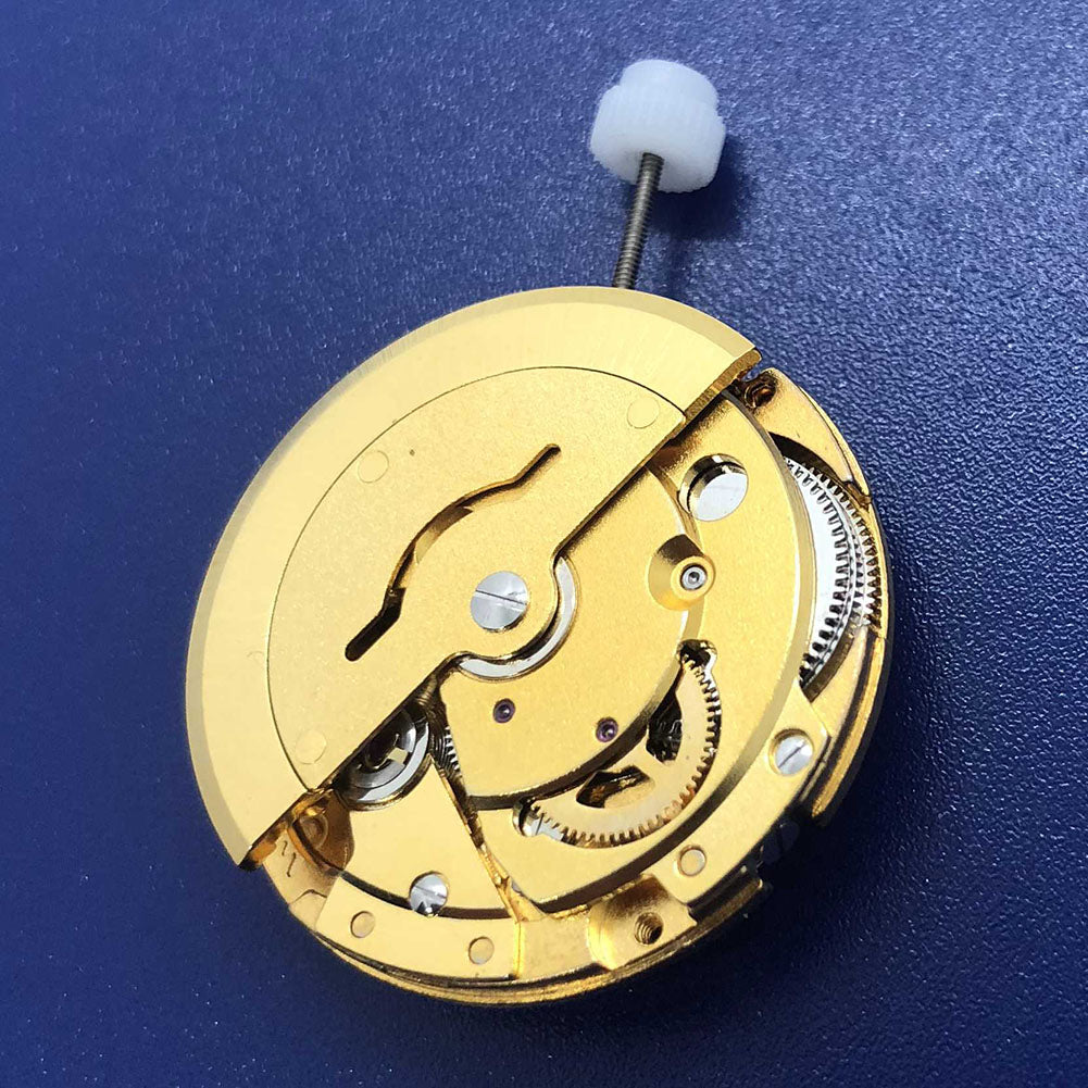 DG2813 automatic mechanical watch movement, gold finish with day and date display, precise timekeeping.