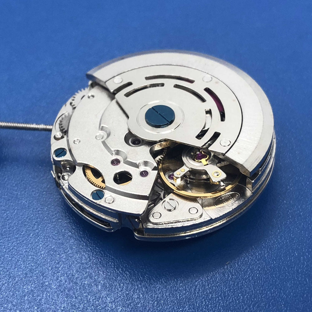 DG2813 automatic watch movement showcasing three large hands and a small second subdial at 6 o'clock, without calendar.