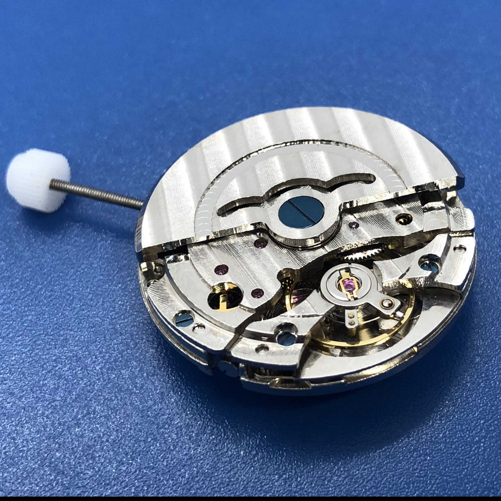 DG2813 automatic mechanical watch movement close-up featuring dual balance wheels and date function.