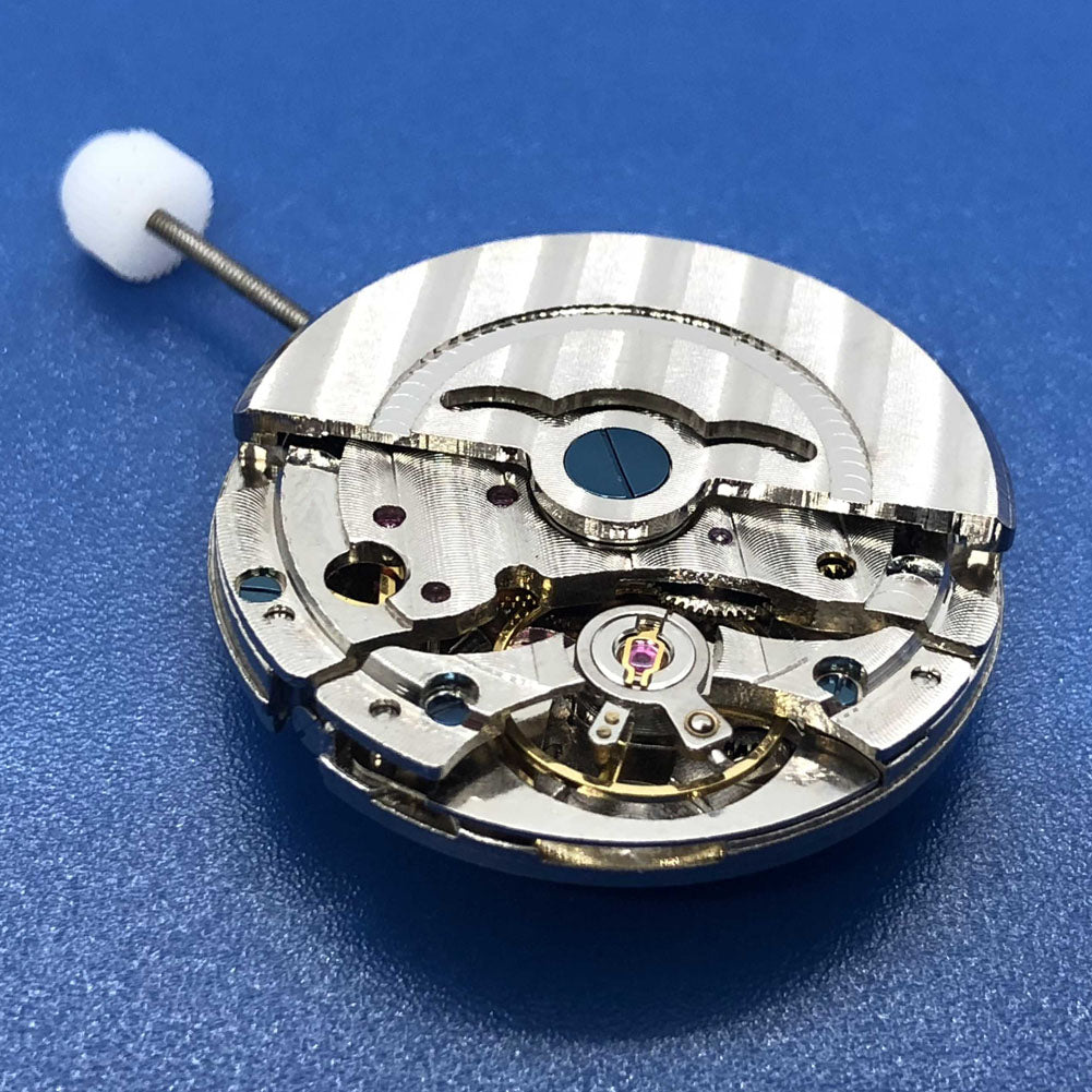 DG2813 automatic watch movement by Seagull featuring mechanical design, dual balance wheels, and date function close-up.