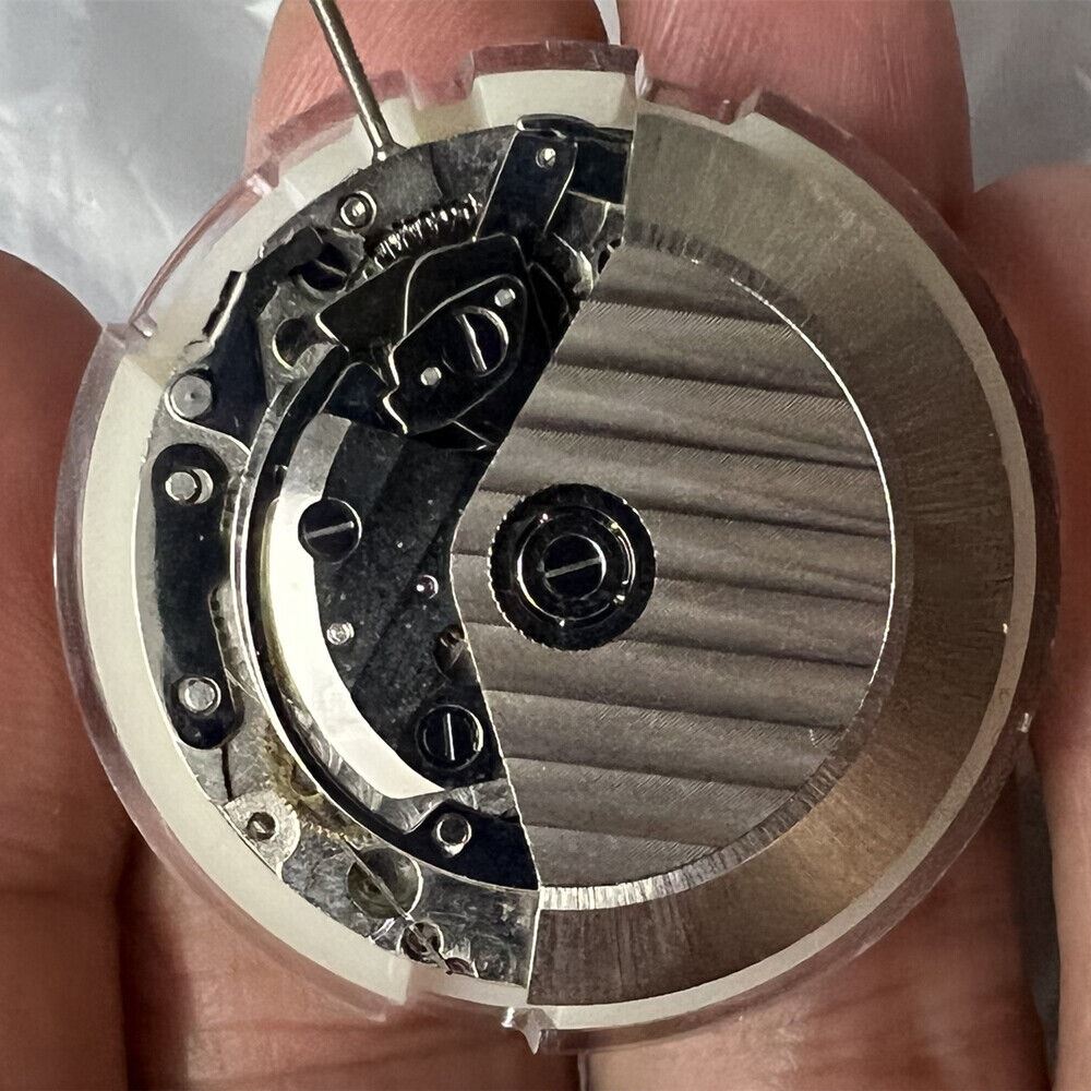 Black dial chronograph watch with ETA 7750 movement and single calendar display.