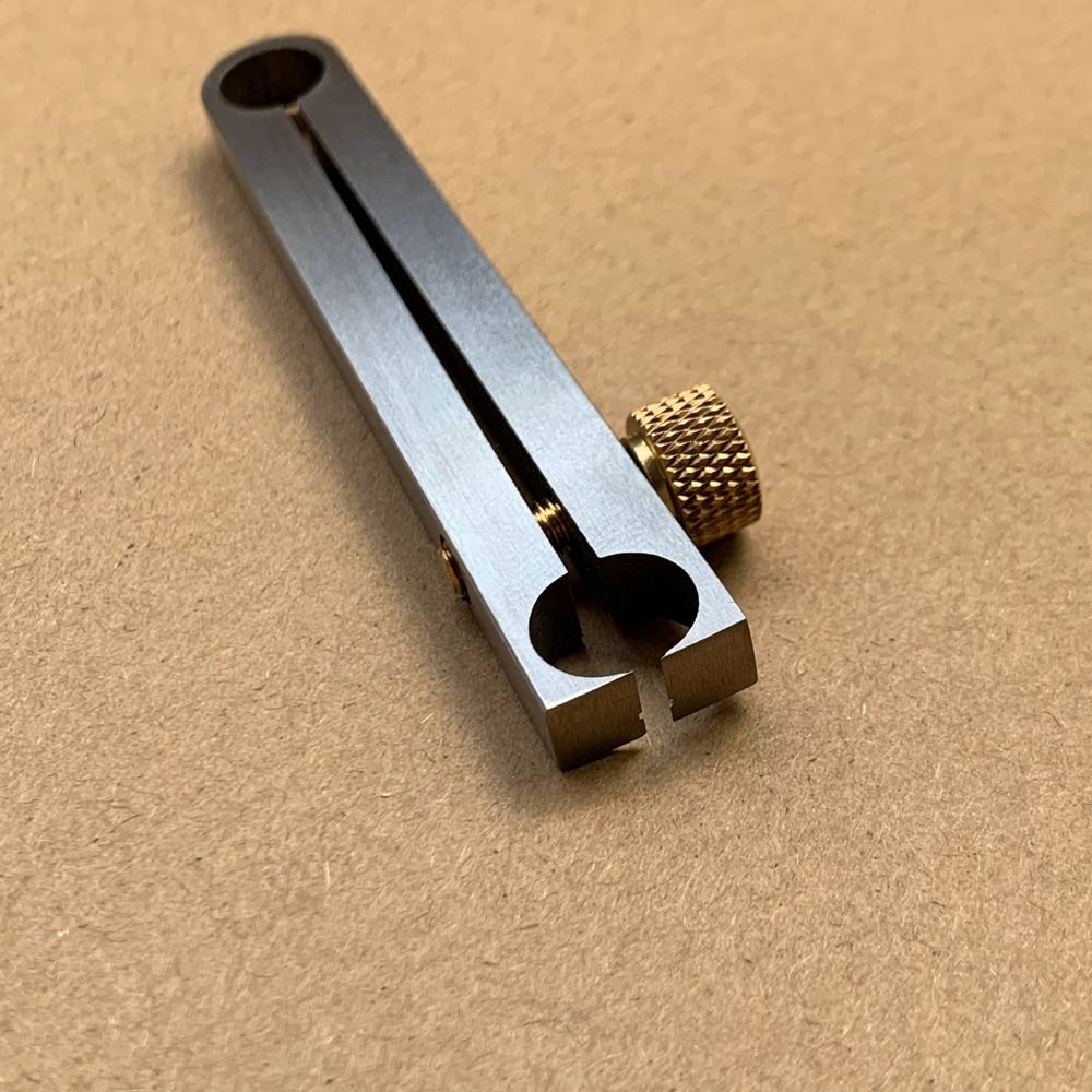 Metal manual center wheel remover tool for watch repair, precise and durable accessory.