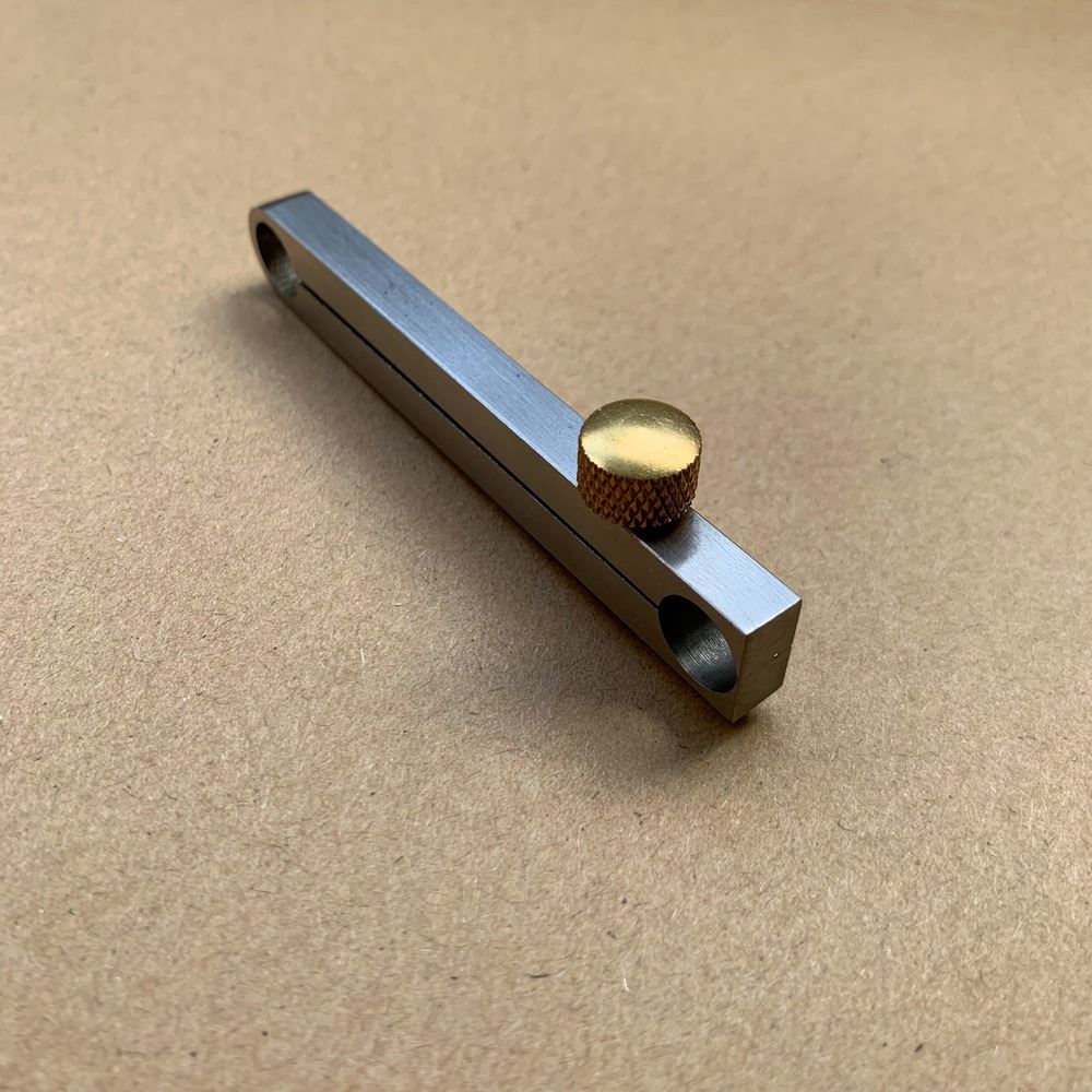 Metal manual center wheel remover tool for precise watch repair, ideal for professionals and hobbyists.
