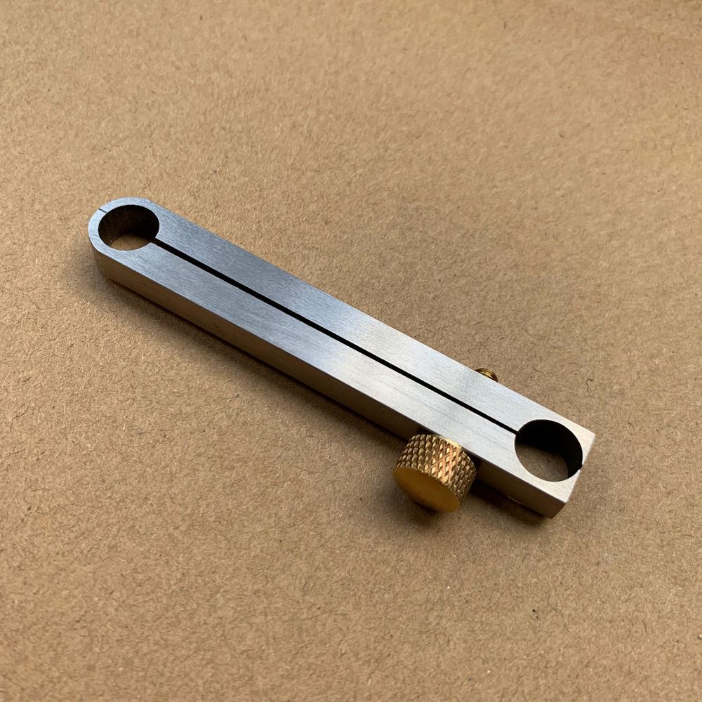 Metal manual center wheel remover tool for watch repair, ensuring precise adjustments by professionals.