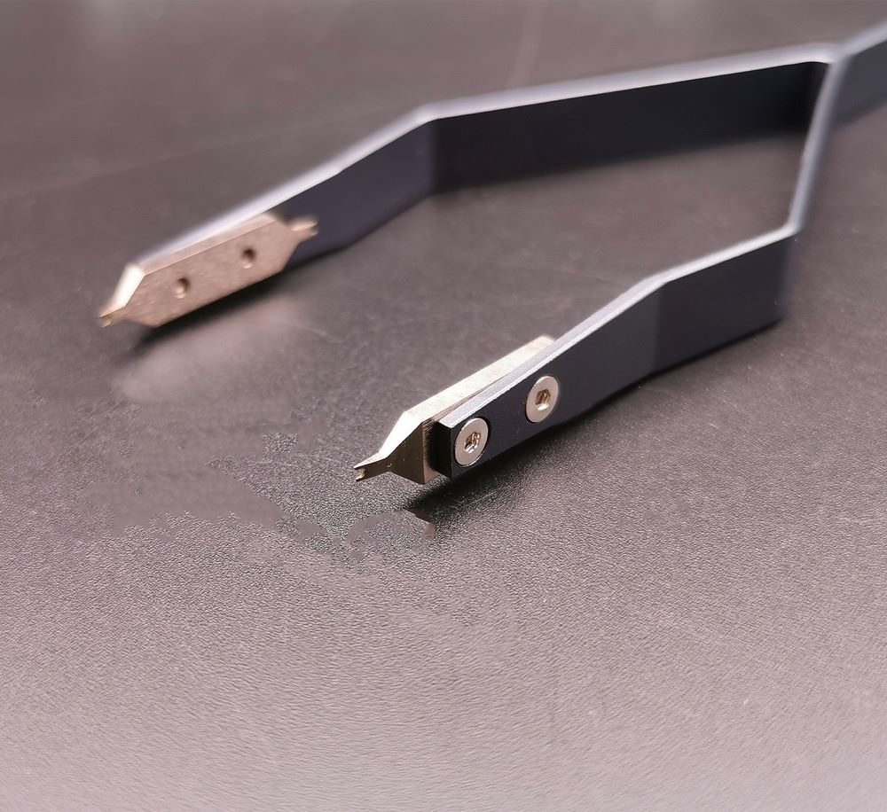 Precision stainless steel V type spring bar tweezers, ideal for delicate watch repair tasks.