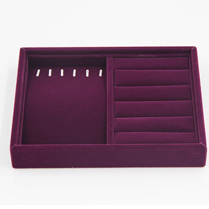 Gray velvet stackable jewelry organizer tray, perfect for neatly storing and displaying watch accessories.