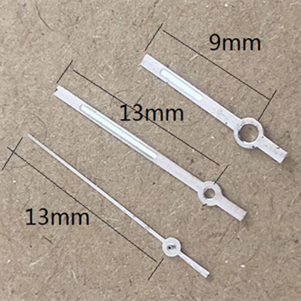 White luminous watch hands with trim for Miyota 2035 quartz movement, enhancing clarity and style.