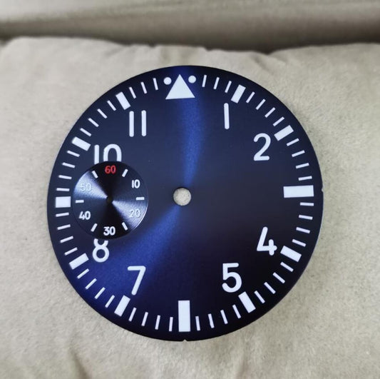 38.9mm blue pilot watch dial with green luminous markers for ETA 6497 movement.