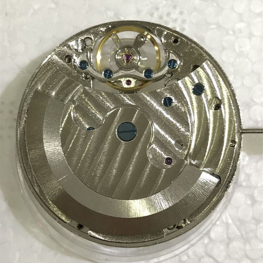 Asian watch accessory showcasing a multi-function tourbillon mechanical movement with moon phase and 24-hour indicators.