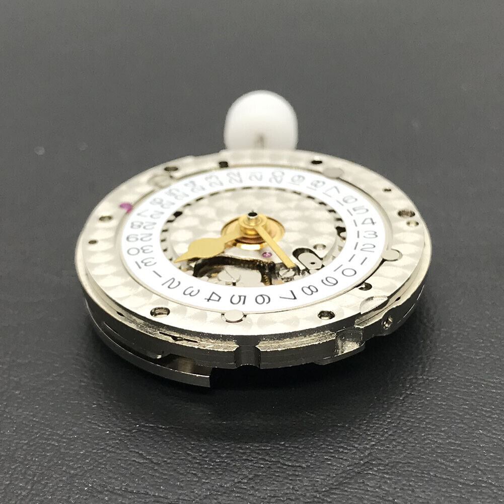 China Made 3186 Automatic GMT watch movement featuring engraved blue balance spring, showcasing precision engineering.
