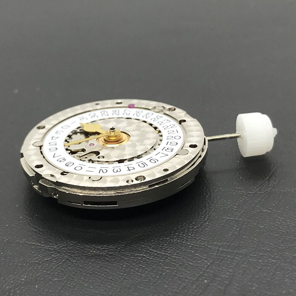 China Made 3186 Automatic GMT watch movement featuring engraved blue balance spring, showcasing precision engineering details.