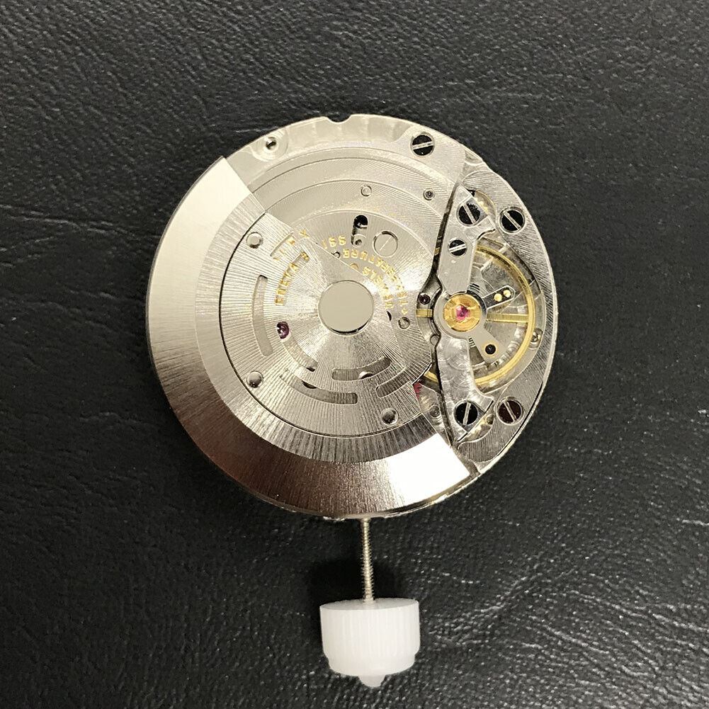 Close-up of China Made 3186 Automatic GMT watch movement featuring engraved blue balance spring and precision craftsmanship.