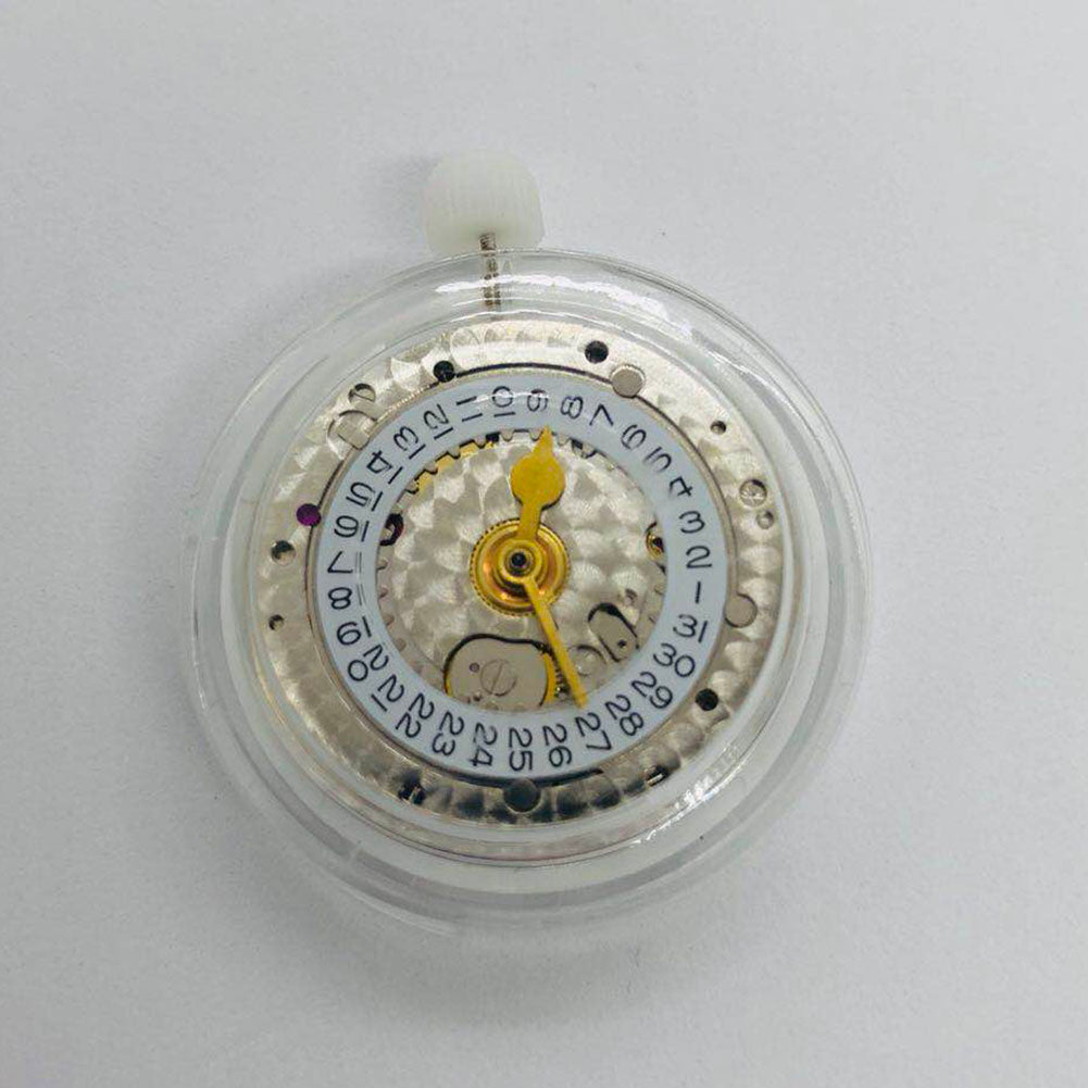 3186 Movement with GMT function and engraved details featuring a blue balance spring for precision timekeeping.