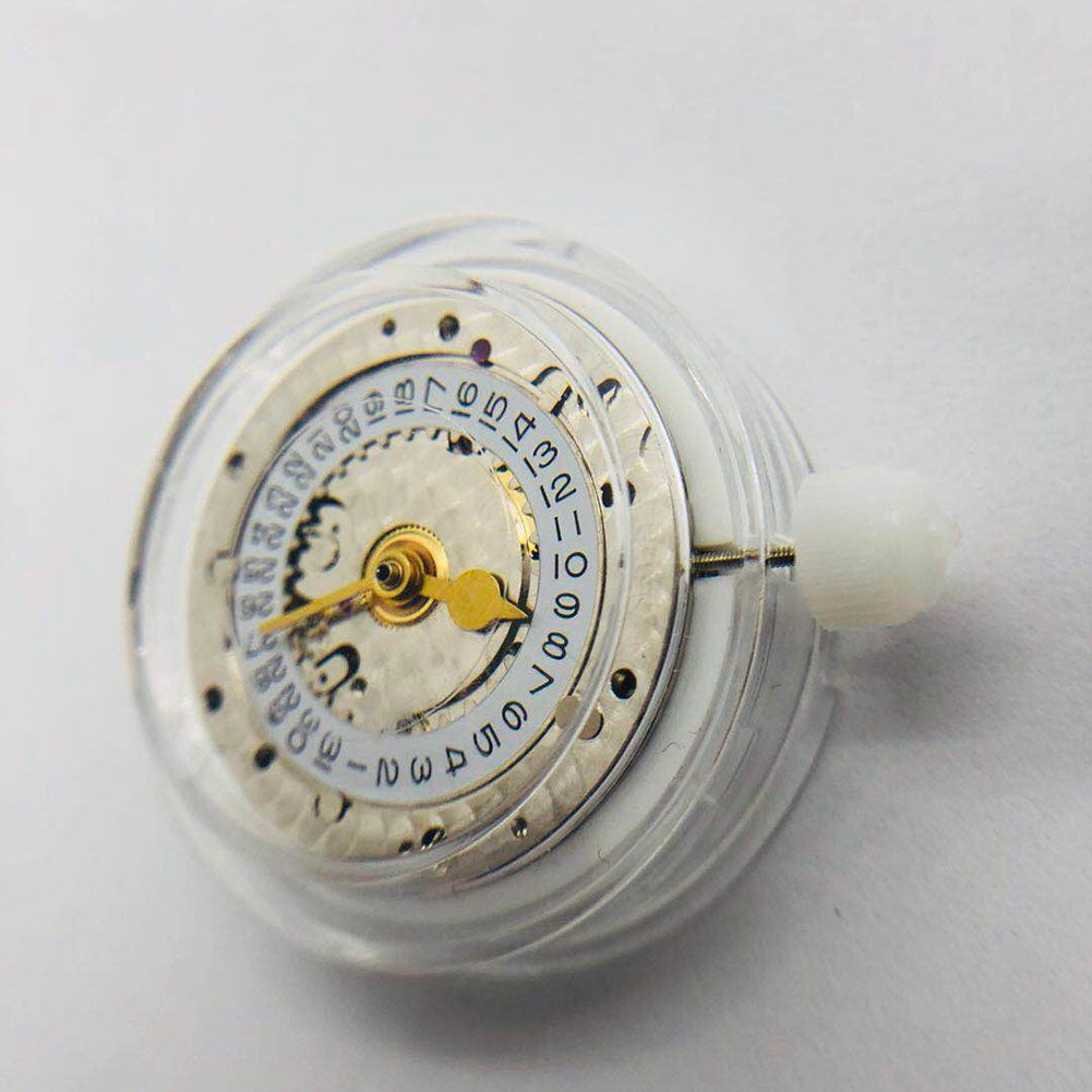 Close-up of 3186 Movement with GMT function and blue balance spring, showcasing precision and engraved details.