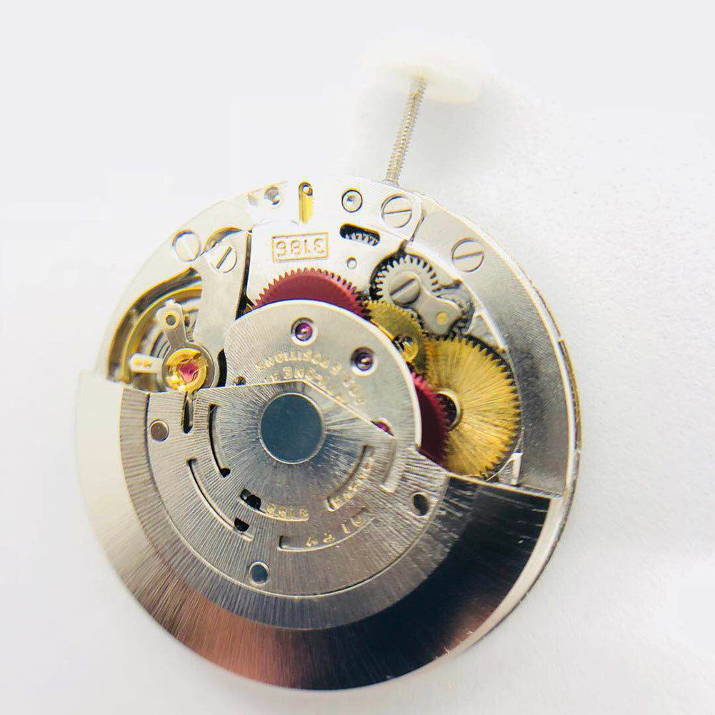 3186 Movement with GMT function, blue balance spring, and engraved details for precise watch performance.