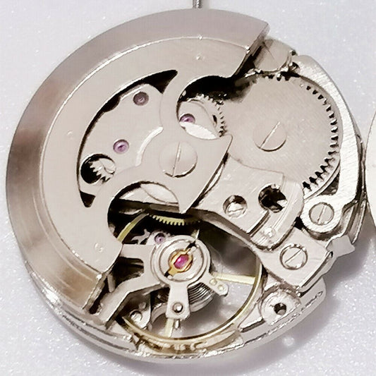 Silver 26.5mm 7120 automatic watch movement with hollow design for mechanical watches, precision.
