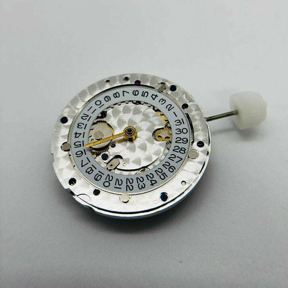 SH3135 watch movement with engraved details and blue balance spring, highlighting precision engineering.