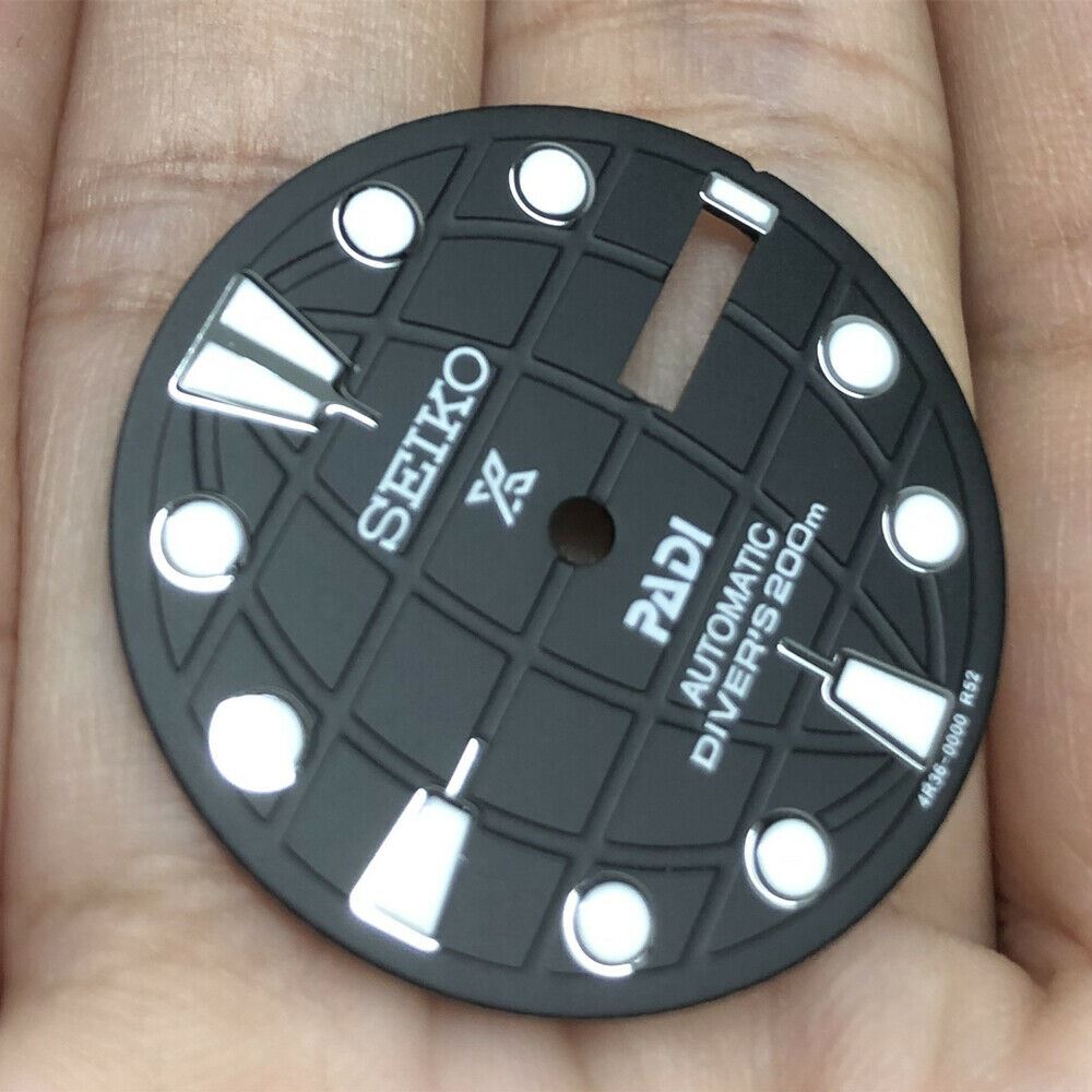 Black 28.50mm luminous watch dial for NH35 movement, designed for enhanced nighttime visibility.