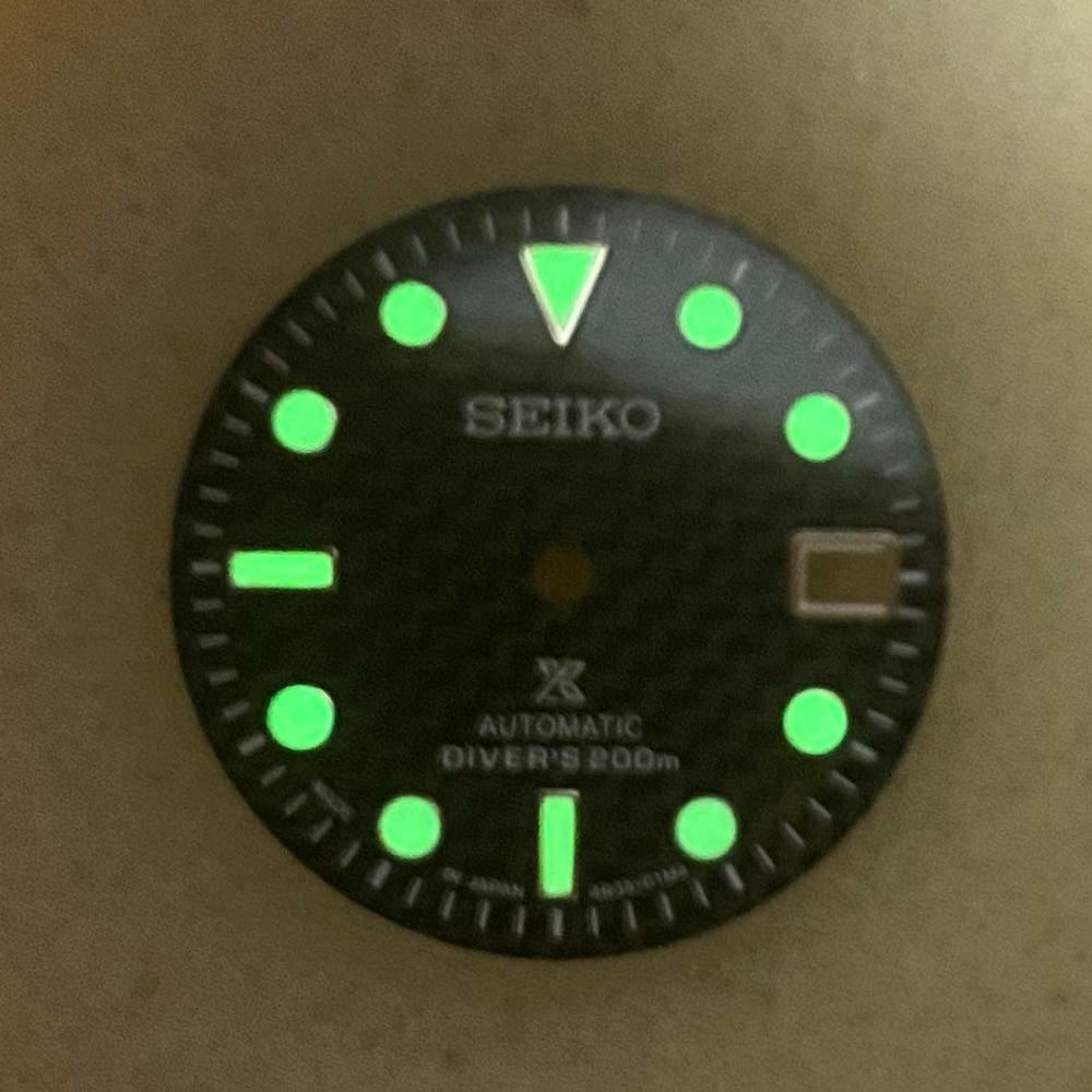 29mm green luminous carbon fibre watch dial by NH35, perfect for custom mechanical watch builds with vibrant glow.