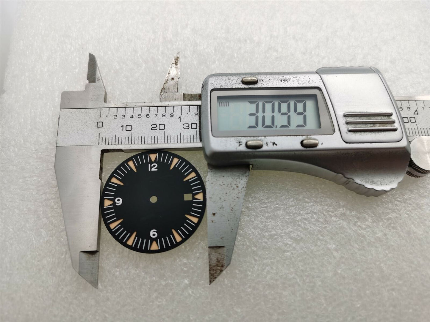 Ghost Omega 31mm watch dial with green luminescent markers, compatible with NH35/NH36, for enhanced legibility.