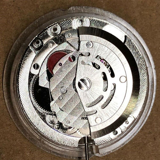China Made ST2147 automatic mechanical watch movement showing day at 12 o'clock and date at 3 o'clock.