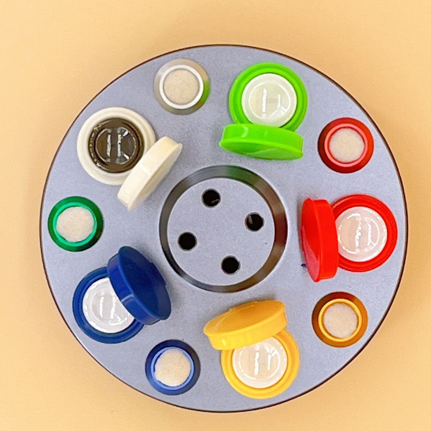 Rotated oil cup stand with 5 containers in die-cast alloy for precise watch repair.