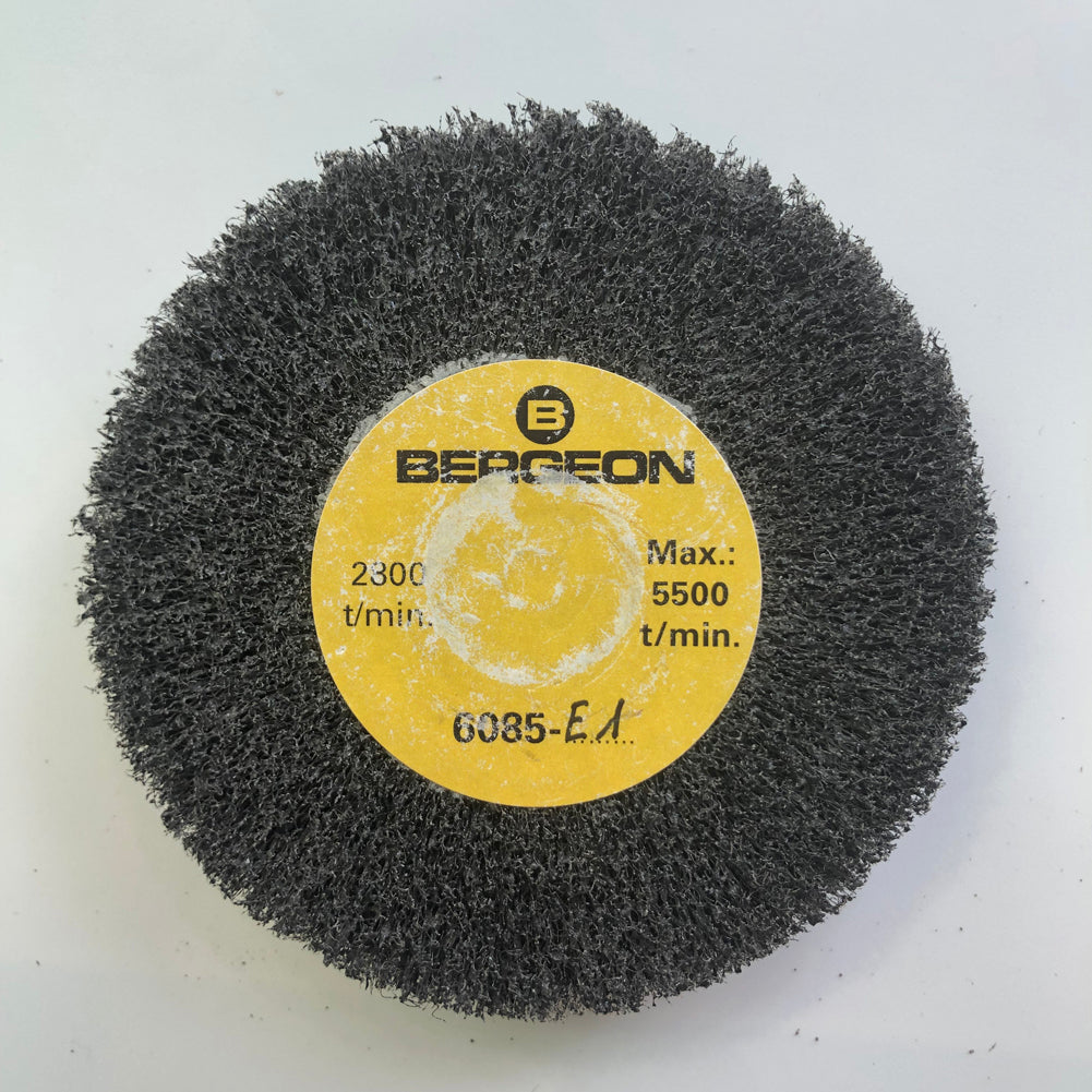 Bergeon 6085-E1 medium abrasive satin finishing wheel for precise watch metal polishing.