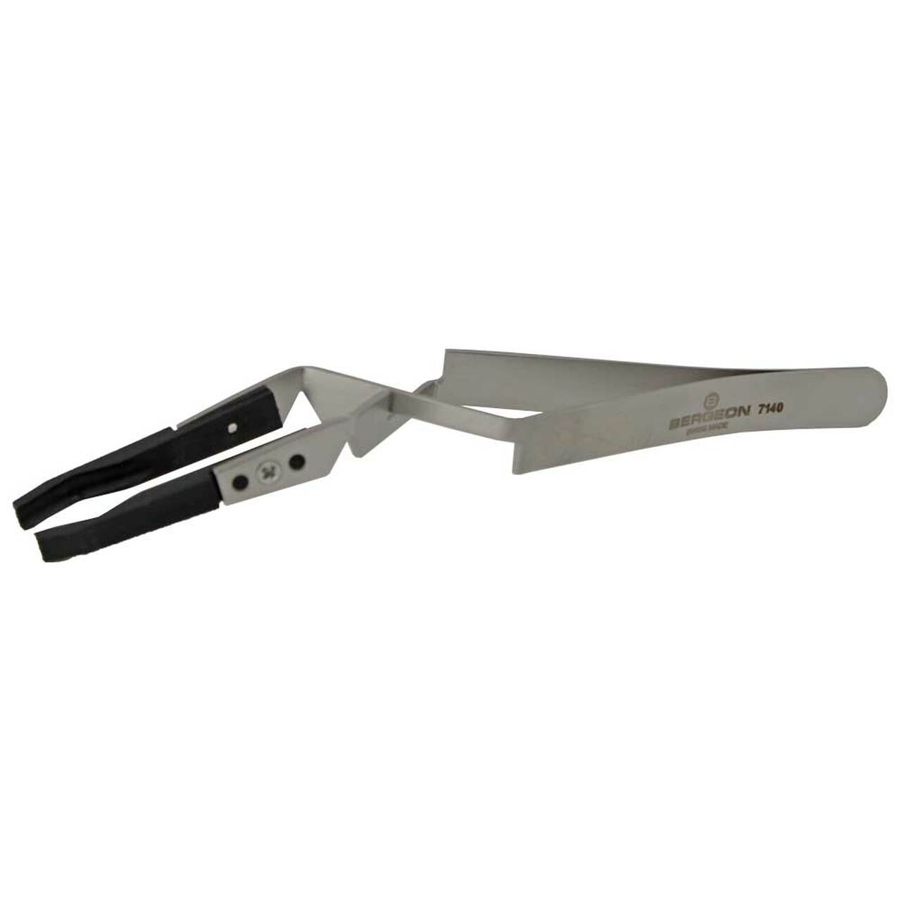 Bergeon 7140 tweezers gripping watch crystals and dials for precise accessory handling.