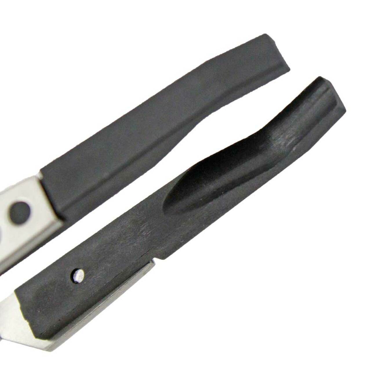 Bergeon 7140 cross locking tweezers gripping watch crystals and dials for precise accessory assembly.