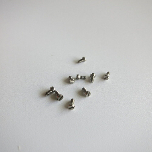 Red round box with 1000PCS AB6004 steel screws for eyeglass and watch repair by AB Brand.