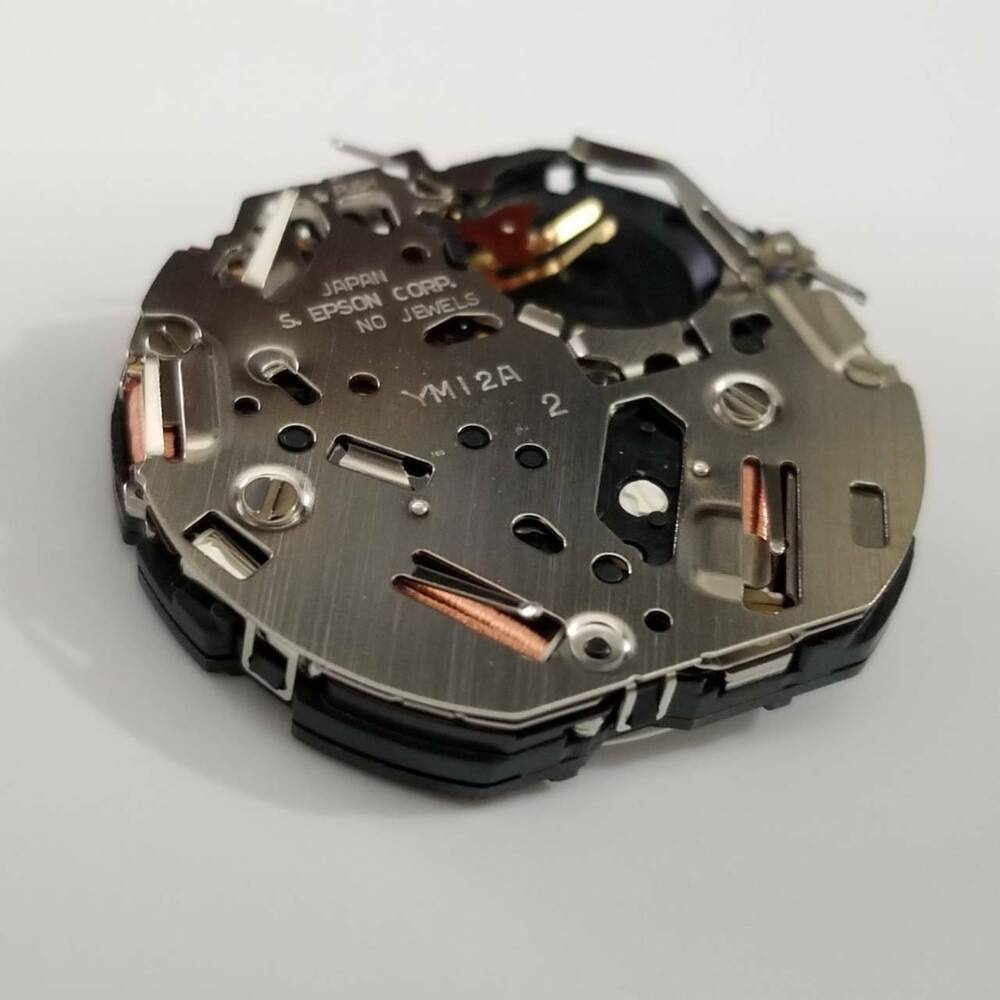 Epson YM12 quartz watch movement for precise timekeeping in watch repairs and accessories.