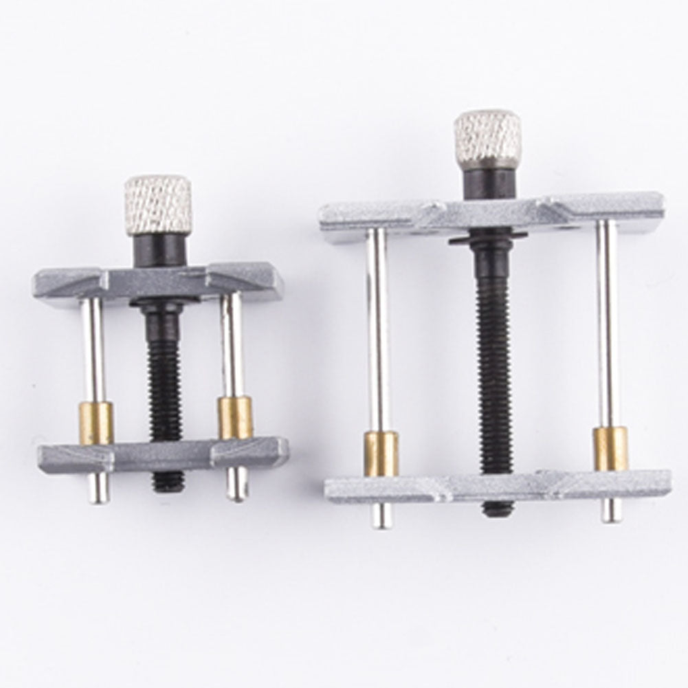 1. Precision metal watch movement holder clamp for secure repairs and adjustments.