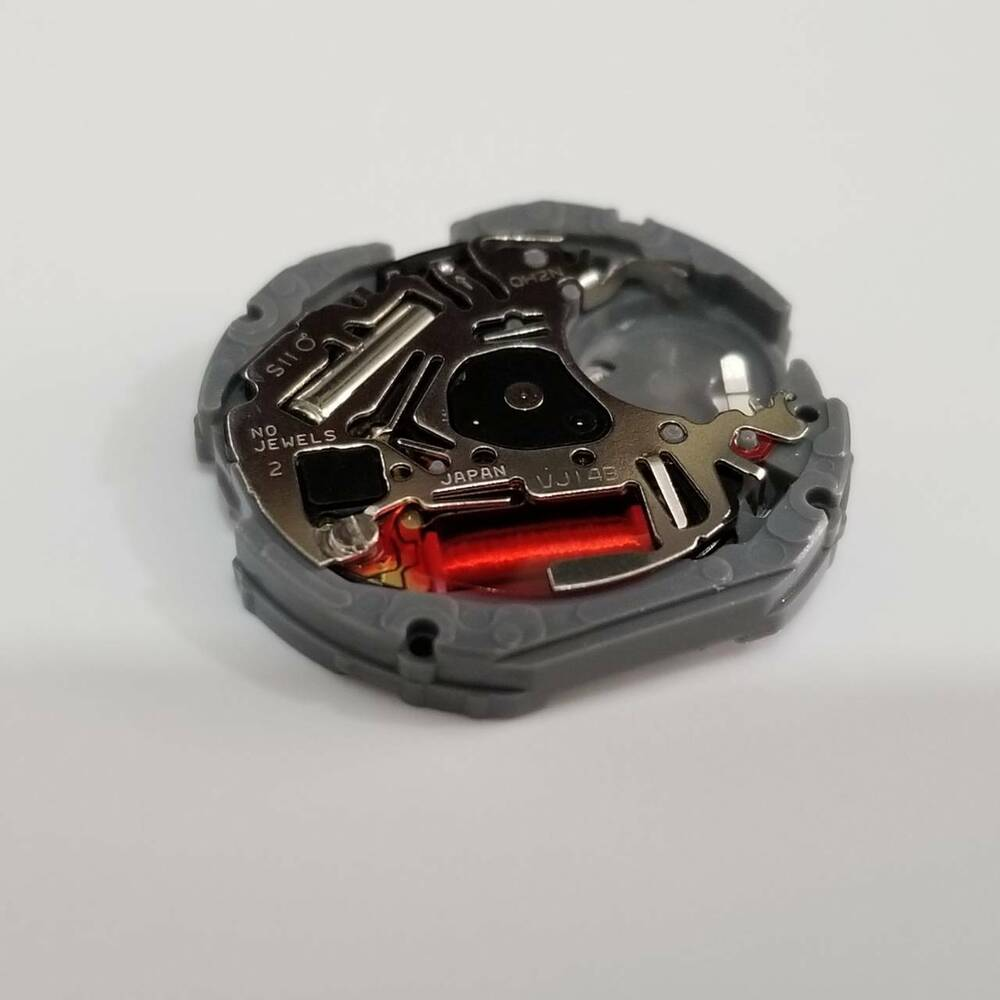 Hattori Epson quartz watch movement showing date display at 3/6, precision Japan-made component.