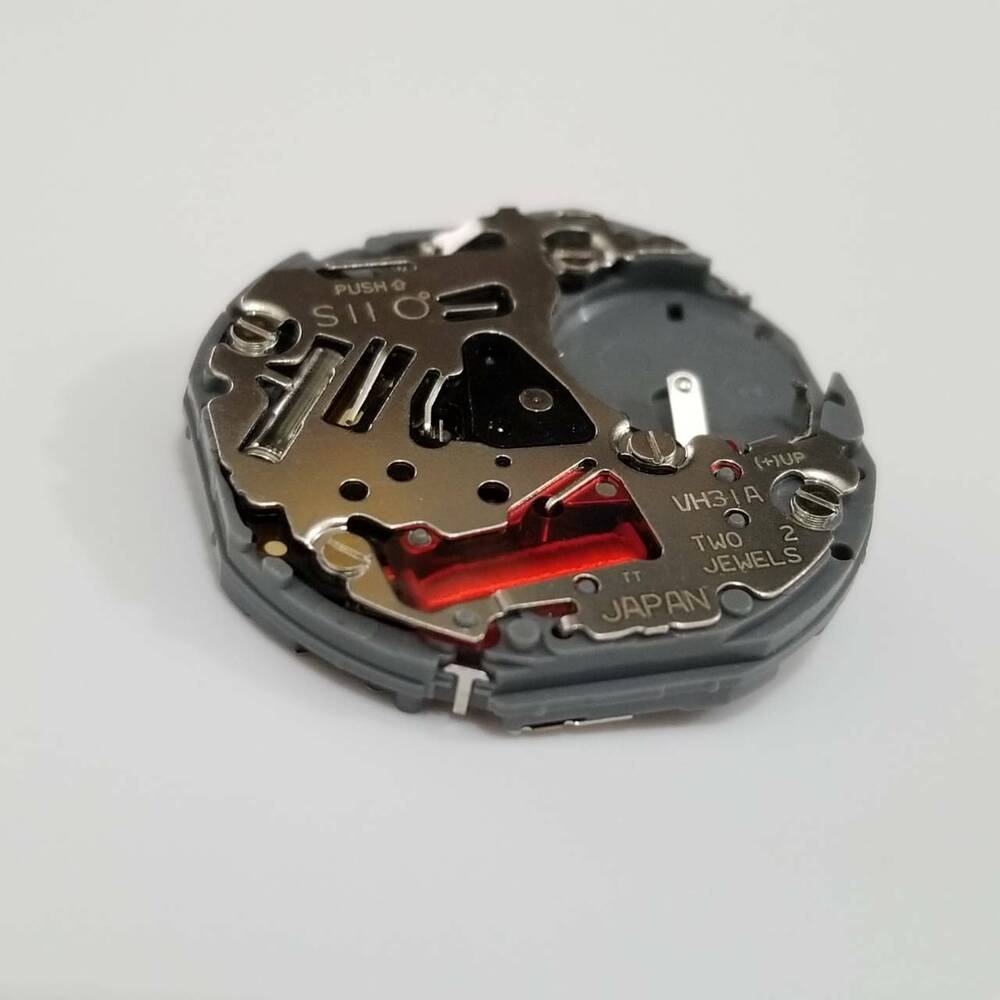 Hattori Epson VH31A quartz watch movement, precise Japanese mechanism for accurate timekeeping.