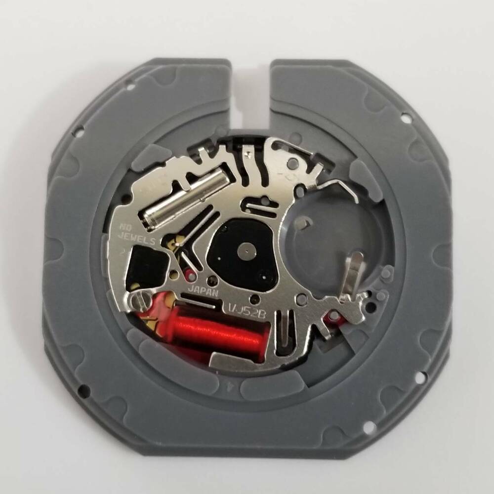 Hattori Epson VJ52B quartz watch movement showing date at 3 o?clock, precise Japanese engineering.