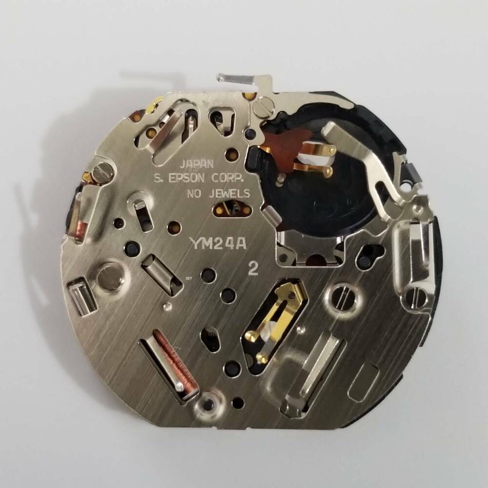 S. Epson YM24 quartz watch movement with precision gears for reliable timekeeping and watch repairs.