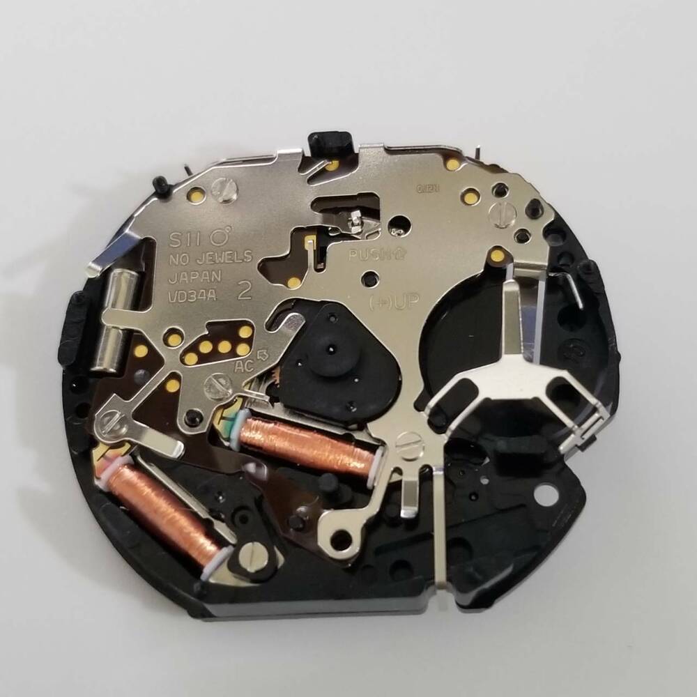 Hattori Epson TMI VD34A quartz watch movement for precise watch repairs and craftsmanship.