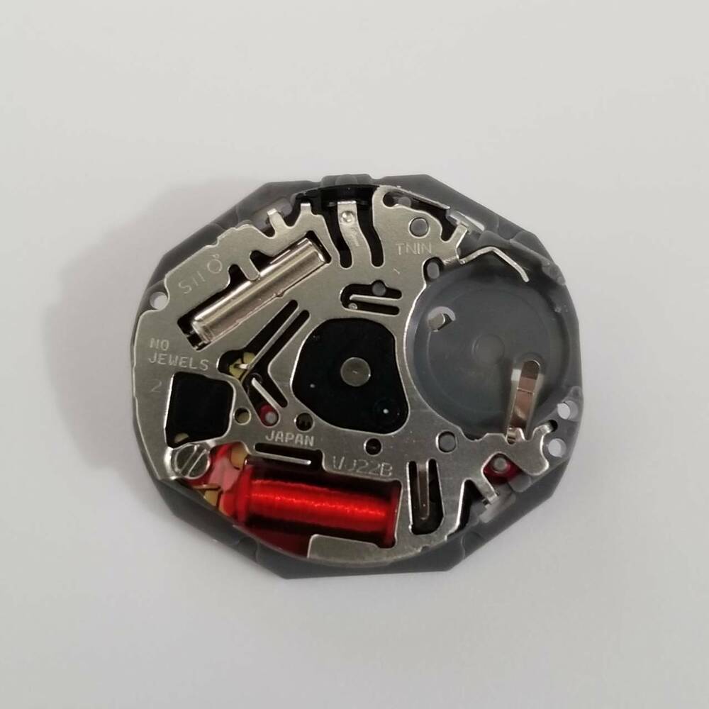 Hattori Epson TMI VJ22 quartz watch movement with date display at 3 and 6 o'clock, Japan made.