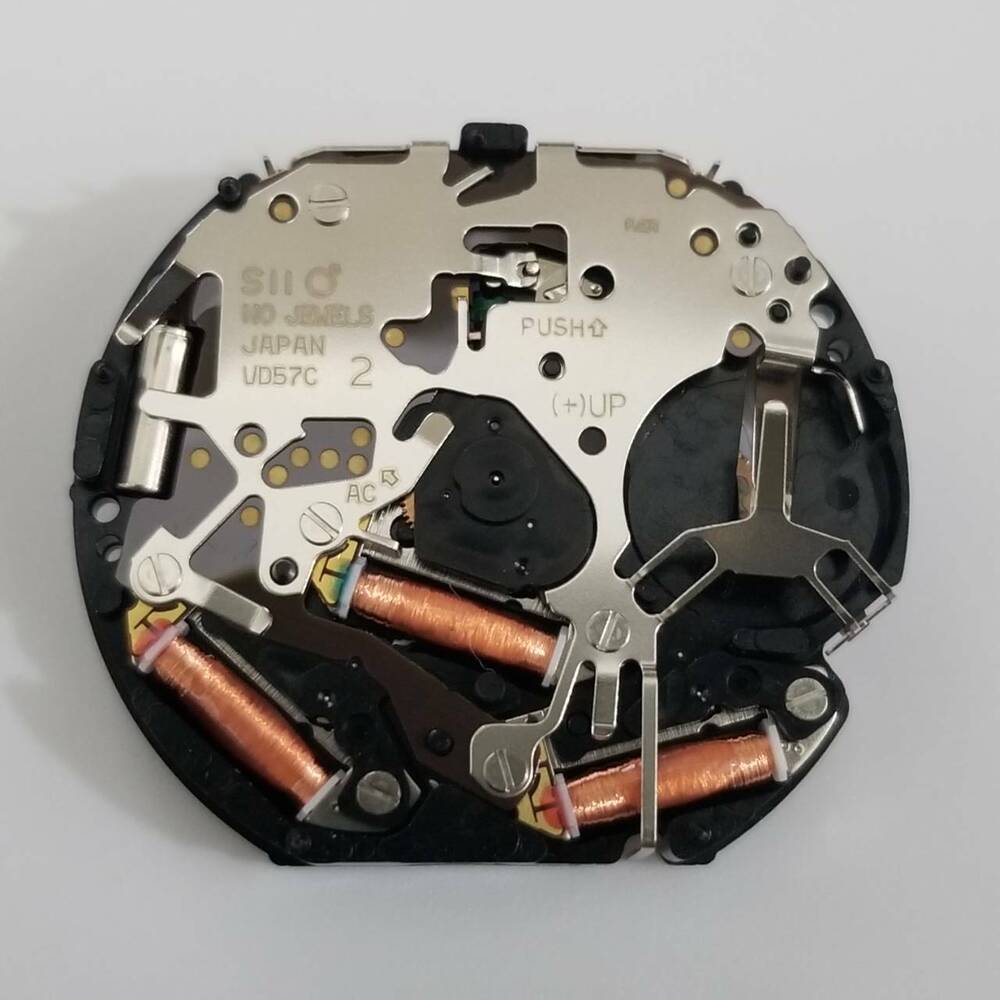 Hattori Epson VD57 quartz watch movement, Japan-made replacement for V657 models, precise timekeeping component.