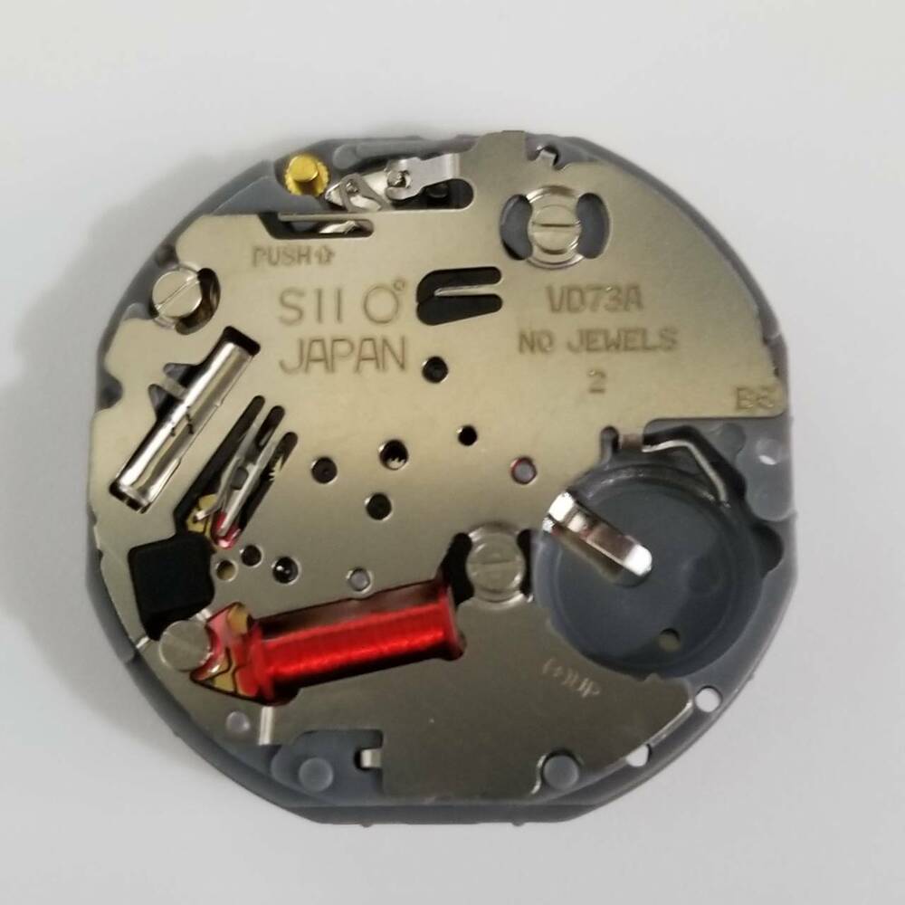 Hattori Epson TMI VD73A quartz movement, precision Japanese watch repair component for accuracy.