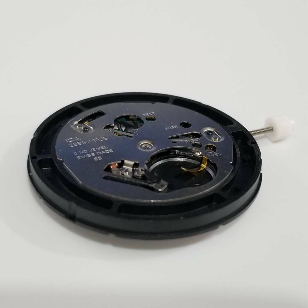 ISA 2334 quartz watch movement featuring a date window at 3 o'clock, ideal for precise watch repairs.