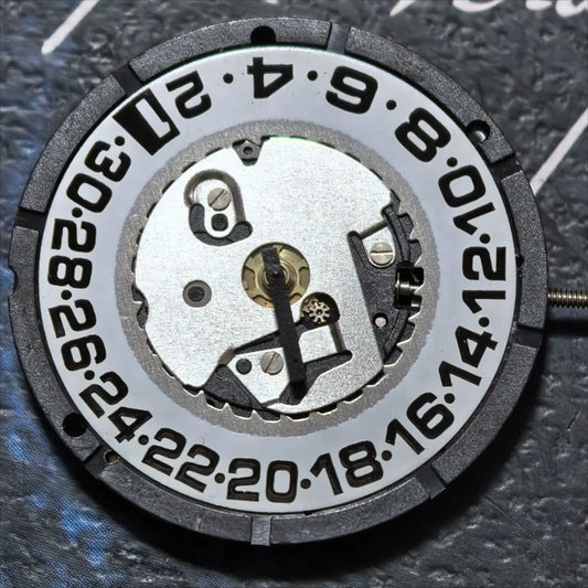 Swiss Made ISA 2330 quartz watch movement with black font date at 6, ideal for precise repairs