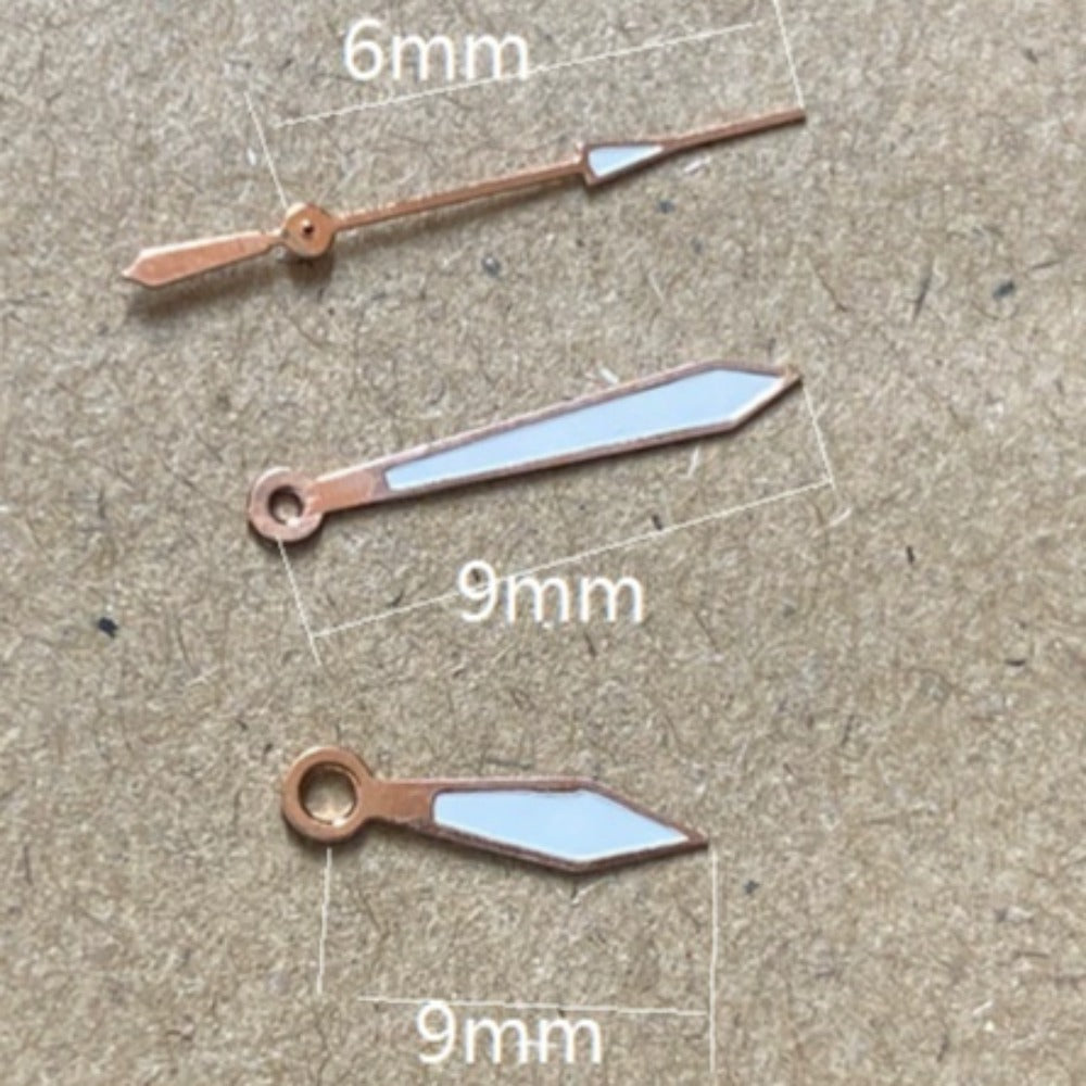Rose gold trimmed green lume watch hands, 9x9x6mm, compatible with Miyota 2035 quartz movement.