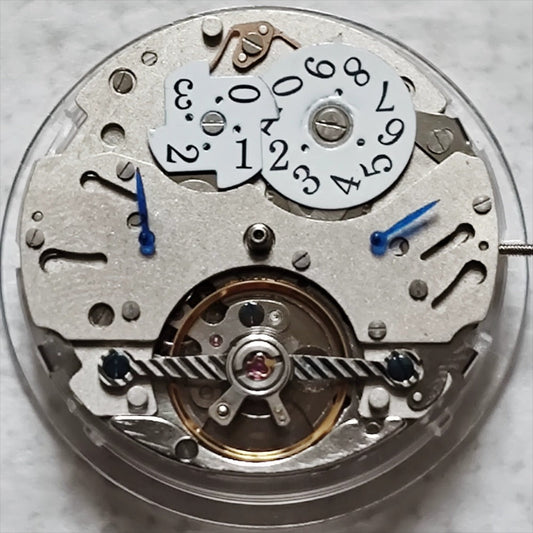 Wenzhou mechanical watch with big date at 12, bare balance wheel at 6, Chinese craftsmanship.