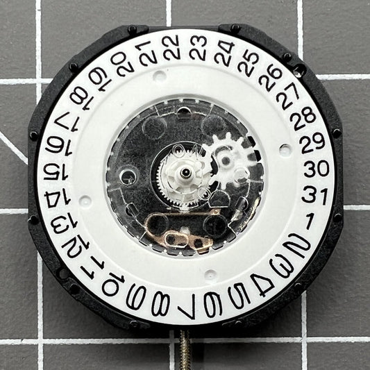 LG32 quartz watch movement with date display at 3 o'clock, precision repair part for watches.
